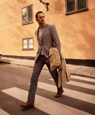 Alexander Skarsgård crossing a street